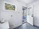 Mudroom with a large window and an exterior door to a covered porch at 497 Turn Key Way, Pittsboro, NC 27312