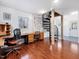 Spacious office with hardwood floors, two desks, and unique spiral staircase at 497 Turn Key Way, Pittsboro, NC 27312