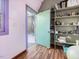 Small room with hardwood floors, shelving, and a view of the outdoors from an open door at 497 Turn Key Way, Pittsboro, NC 27312
