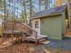 Charming shed with painted wood siding and a small front deck offers an inviting space at 497 Turn Key Way, Pittsboro, NC 27312