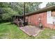 Brick patio adjacent to a deck and screened porch at 5008 Rolesville Rd, Knightdale, NC 27545