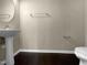Simple bathroom with pedestal sink and dark floors at 5023 Lalex Ln, Cary, NC 27519
