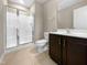 Clean bathroom with shower and dark brown vanity at 5023 Lalex Ln, Cary, NC 27519
