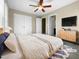 Spacious bedroom with double doors and ceiling fan at 5023 Lalex Ln, Cary, NC 27519