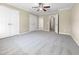 Bright bedroom with plush carpeting and double doors leading to hallway at 5023 Lalex Ln, Cary, NC 27519