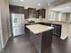 Modern kitchen with granite island and stainless steel appliances at 5023 Lalex Ln, Cary, NC 27519