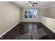 Living room with dark hardwood floors and ceiling fan at 5023 Lalex Ln, Cary, NC 27519