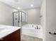 Bathroom features a shower, soaking tub, and double vanity at 520 Matheson Pl, Cary, NC 27511