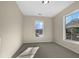 Well-lit bedroom with neutral walls and carpet at 520 Matheson Pl, Cary, NC 27511