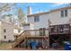Elevated deck overlooking backyard, with stairs and storage at 6539 English Oaks Dr, Raleigh, NC 27615