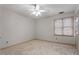 Bedroom with ceiling fan and window overlooking trees at 6539 English Oaks Dr, Raleigh, NC 27615