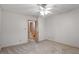 Bedroom with ceiling fan and access to upper hallway at 6539 English Oaks Dr, Raleigh, NC 27615