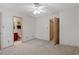 Bedroom with ceiling fan and access to two bathrooms at 6539 English Oaks Dr, Raleigh, NC 27615