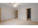 Bedroom with ceiling fan and access to bathroom and hallway at 6539 English Oaks Dr, Raleigh, NC 27615