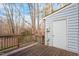 Wooden deck with storage door and wooded views at 6539 English Oaks Dr, Raleigh, NC 27615