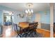 Bright dining area with hardwood floors and chandelier at 6539 English Oaks Dr, Raleigh, NC 27615