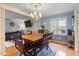 Charming dining room with hardwood floors and chandelier at 6539 English Oaks Dr, Raleigh, NC 27615
