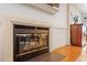 Gas fireplace with glass doors and a white mantel at 6539 English Oaks Dr, Raleigh, NC 27615