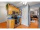 Updated kitchen with stainless steel appliances and wood cabinets at 6539 English Oaks Dr, Raleigh, NC 27615