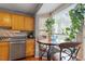 Kitchen breakfast nook with bay window and wood cabinets at 6539 English Oaks Dr, Raleigh, NC 27615