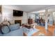 Open living and dining area with hardwood floors and fireplace at 6539 English Oaks Dr, Raleigh, NC 27615