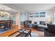 Open concept living room with hardwood floors and fireplace at 6539 English Oaks Dr, Raleigh, NC 27615
