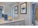 Clean bathroom with double sinks and a shower/tub combo at 661 Morning Glade St, Wake Forest, NC 27587