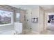 Spa-like bathroom with a large shower and soaking tub at 661 Morning Glade St, Wake Forest, NC 27587