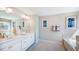 Elegant bathroom with double vanity and soaking tub at 661 Morning Glade St, Wake Forest, NC 27587