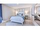 Bright bedroom featuring a comfortable bed and soft color palette at 661 Morning Glade St, Wake Forest, NC 27587