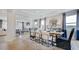 Open dining room with hardwood floors and large windows at 661 Morning Glade St, Wake Forest, NC 27587