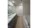 Bathroom boasts double vanity, granite countertop, and garden tub at 75 Shiloh Dr, Lillington, NC 27546
