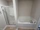 Bathroom features a shower and a relaxing garden tub at 75 Shiloh Dr, Lillington, NC 27546