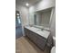 Double vanity bathroom with granite countertop and large mirror at 75 Shiloh Dr, Lillington, NC 27546