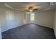Primary bedroom with ensuite bathroom access and ceiling fan at 75 Shiloh Dr, Lillington, NC 27546