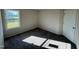 Simple bedroom with grey carpet and neutral walls at 75 Shiloh Dr, Lillington, NC 27546