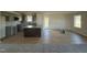 Modern kitchen with grey cabinets, granite countertops, and a kitchen island at 75 Shiloh Dr, Lillington, NC 27546