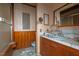 Small bathroom with vintage fixtures and wood paneling at 90 Little Indian Creek Rd, Goldston, NC 27252