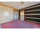 Small bedroom with pink carpet and closet at 90 Little Indian Creek Rd, Goldston, NC 27252