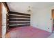 Dining room with pink carpet and log wall at 90 Little Indian Creek Rd, Goldston, NC 27252