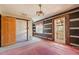 Dining room with pink carpet and log wall at 90 Little Indian Creek Rd, Goldston, NC 27252