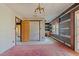 Dining room with pink carpet and log wall at 90 Little Indian Creek Rd, Goldston, NC 27252