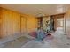 Empty exercise room with elliptical and wood walls at 90 Little Indian Creek Rd, Goldston, NC 27252