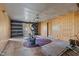 Empty exercise room with elliptical and wood walls at 90 Little Indian Creek Rd, Goldston, NC 27252