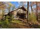 Rustic log cabin in wooded area with balcony at 90 Little Indian Creek Rd, Goldston, NC 27252