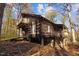 Elevated log cabin, multiple levels, wooded setting at 90 Little Indian Creek Rd, Goldston, NC 27252