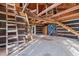 Unfinished interior with exposed beams and staircase at 90 Little Indian Creek Rd, Goldston, NC 27252