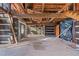 Unfinished interior with exposed beams and staircase at 90 Little Indian Creek Rd, Goldston, NC 27252