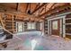 Open concept interior with exposed beams and unfinished flooring at 90 Little Indian Creek Rd, Goldston, NC 27252