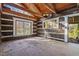 Unfinished interior room with exposed beams and wood walls at 90 Little Indian Creek Rd, Goldston, NC 27252